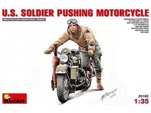 U.S. Soldier Pushing Motorcycle